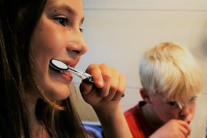 Children Brushing Teeth Together