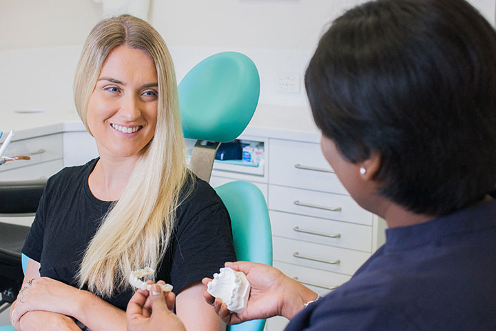 Perth dentist Fremantle dental clinic Hilton patient with beautiful smile in dental chair Perth dentist Fremantle dental clinic Hilton patient with beautiful smile in dental chair
